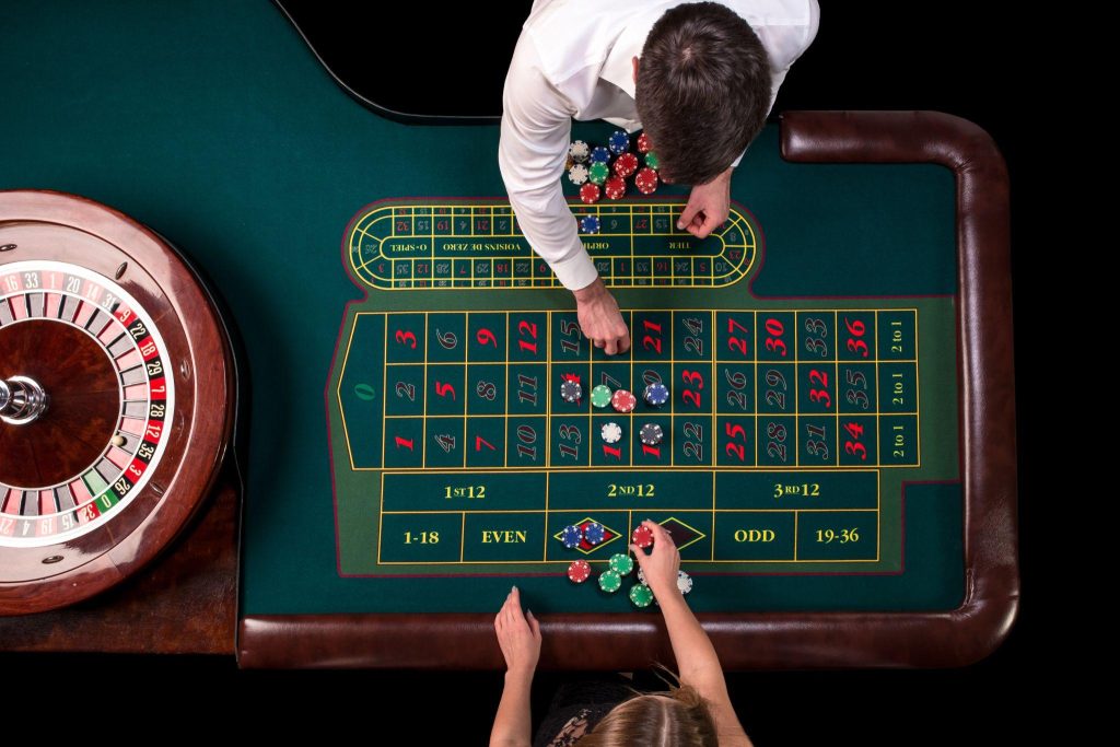 a top down view of a roulette table in a casino wi